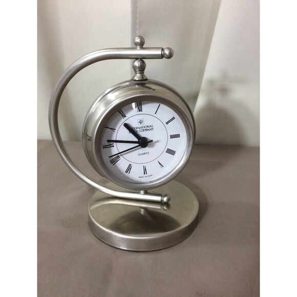 International Silver Desk Clock Rotates Quartz Battery Operated 6" Tall Working - Picture 2 of 4